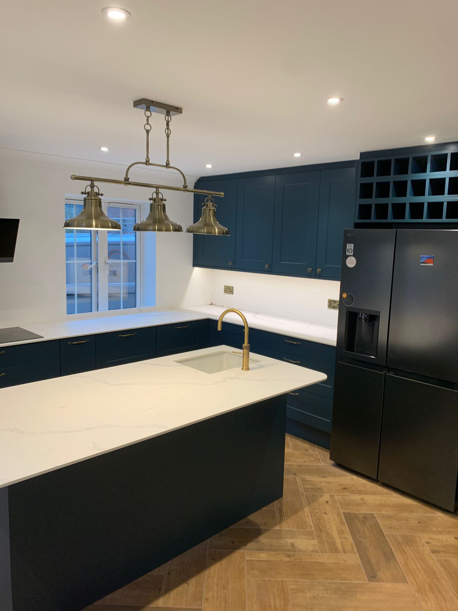 Dark blue kitchen with island